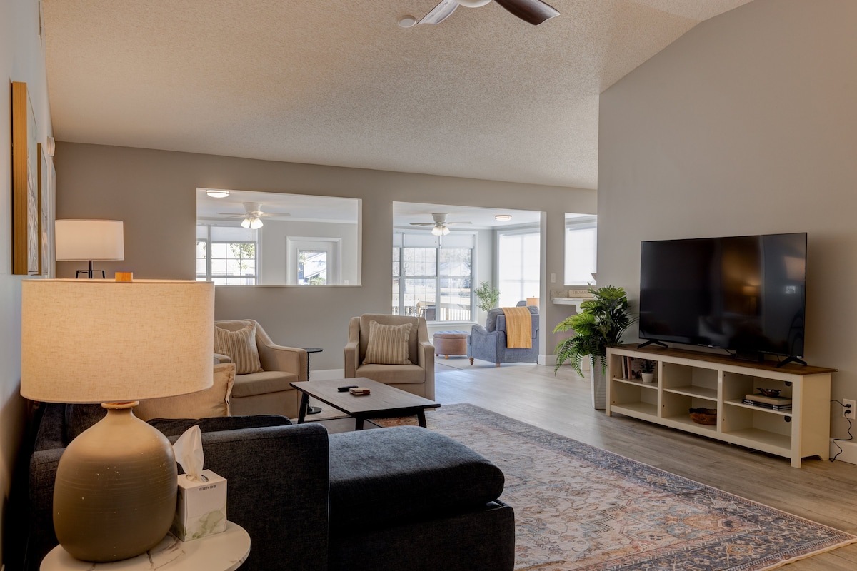 Bright living room at Tall Timbers Waterfront Oasis