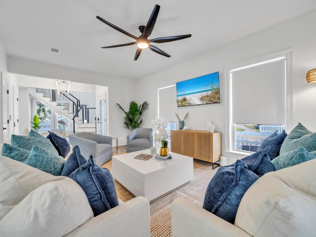 Living room with pale blue sofas at Sea-N-Double