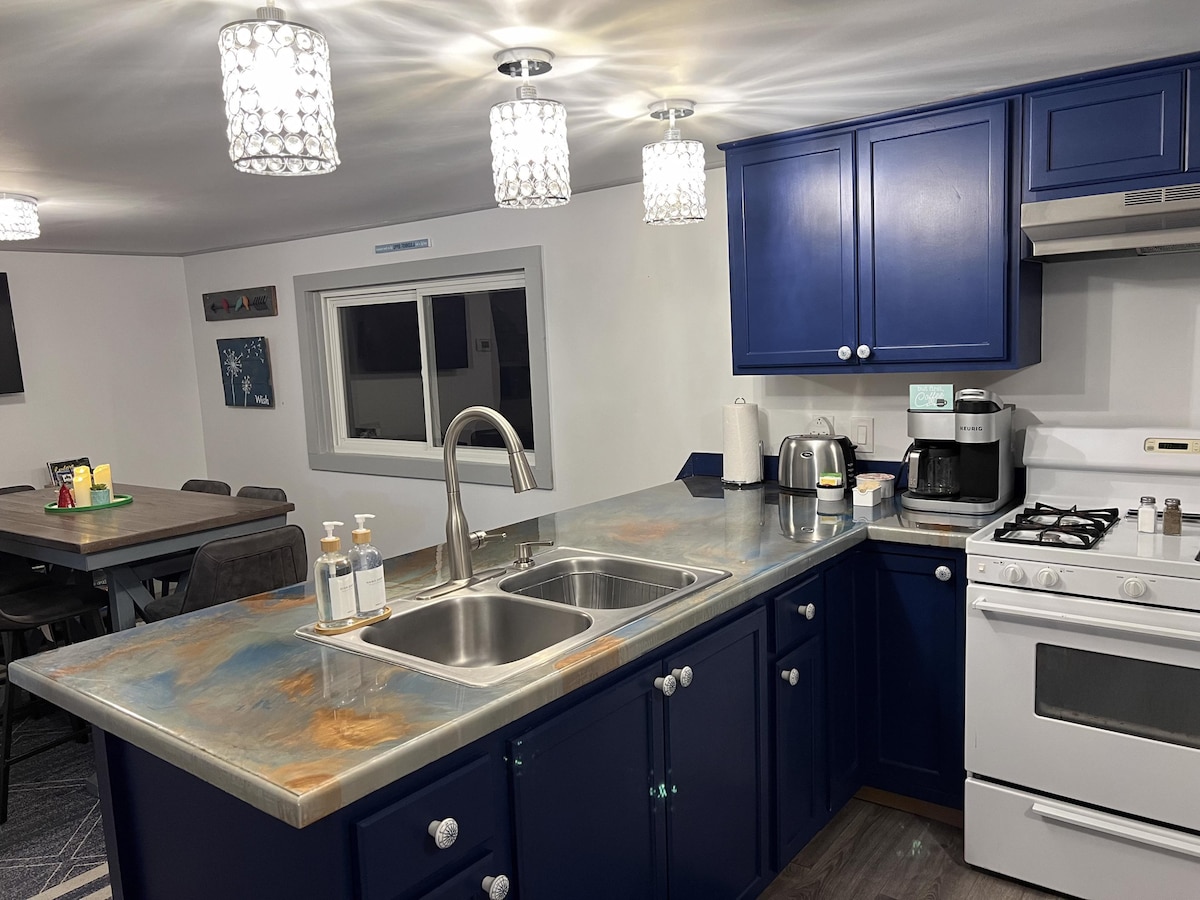 Blue cabinets and sink in the kitchen at Paradise Lakeside Retreat