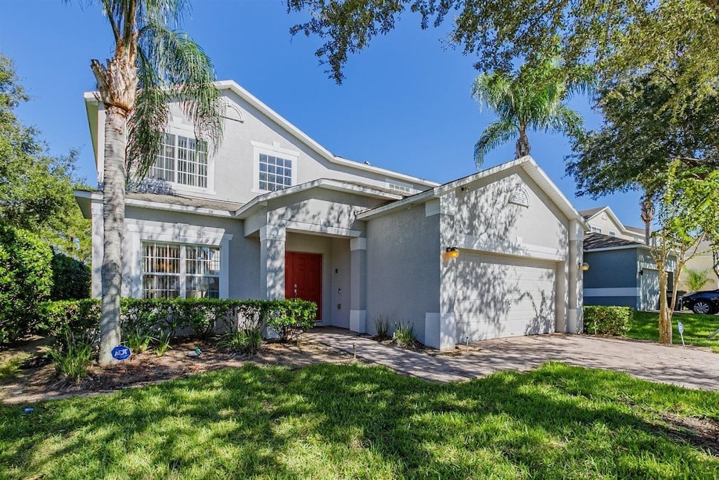 Exterior of Castaway Breeze with lawn and palm trees