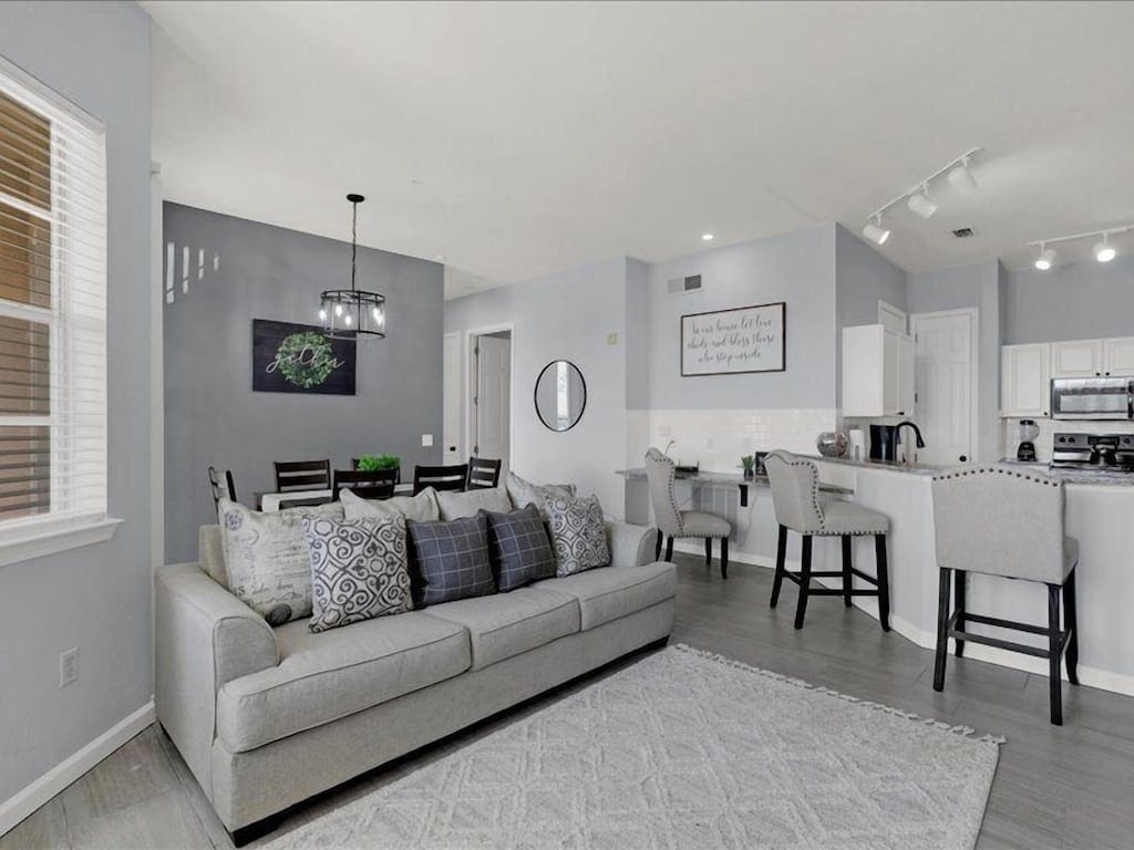 Open-plan living and dining area inside Sunshine Terrace Villa