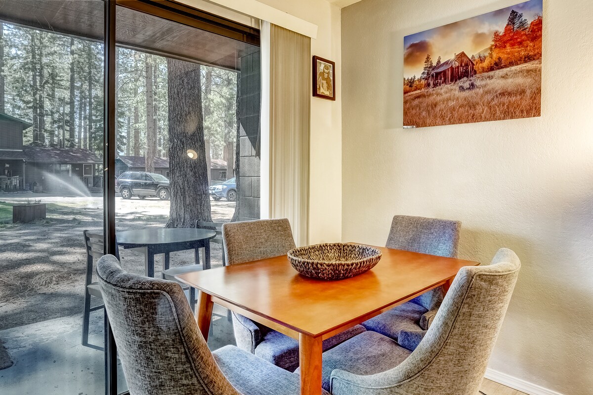 Dining table by sliding doors and covered patio at Emerald Bay Gateway