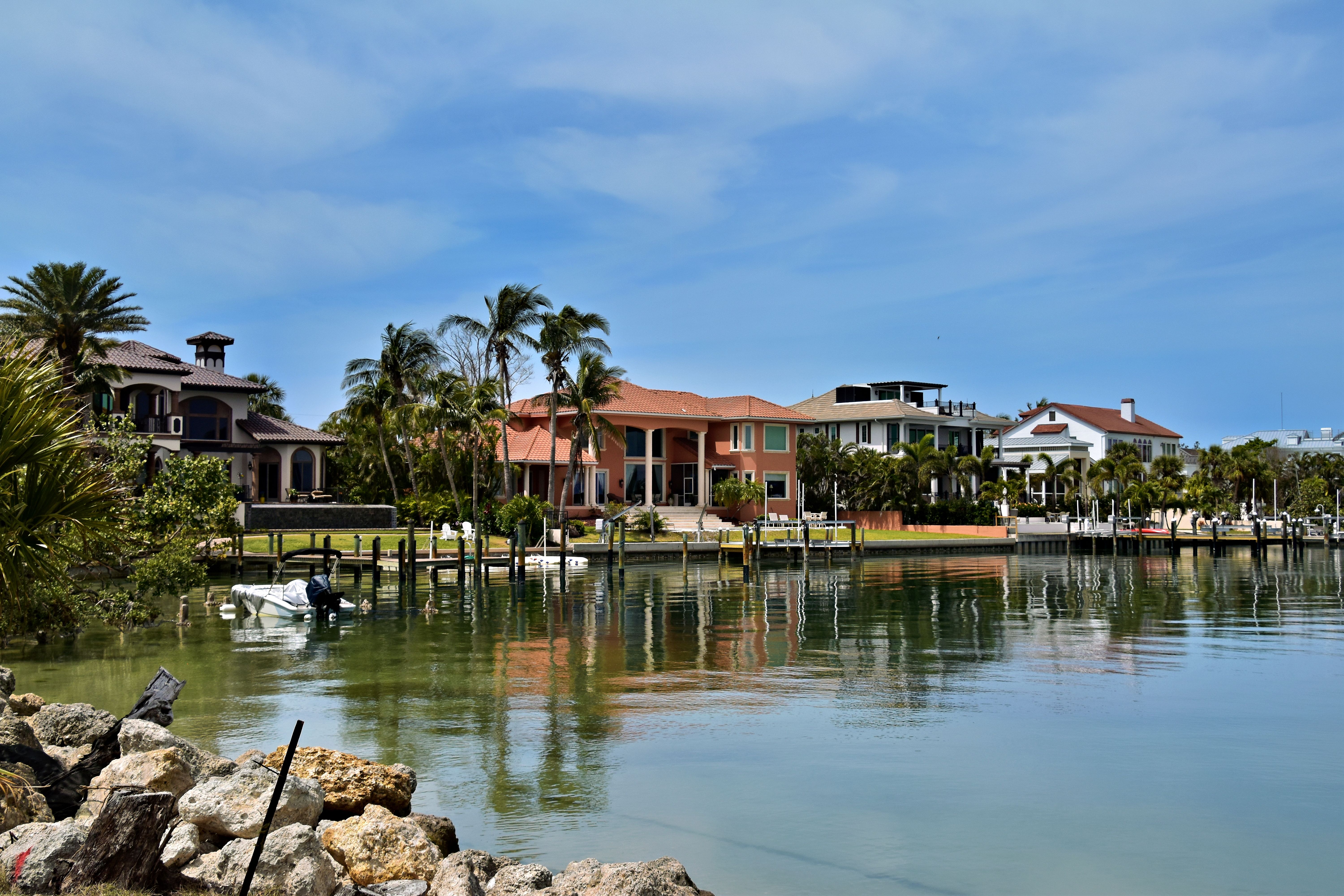Stock photograph of homes along a tropical coastline