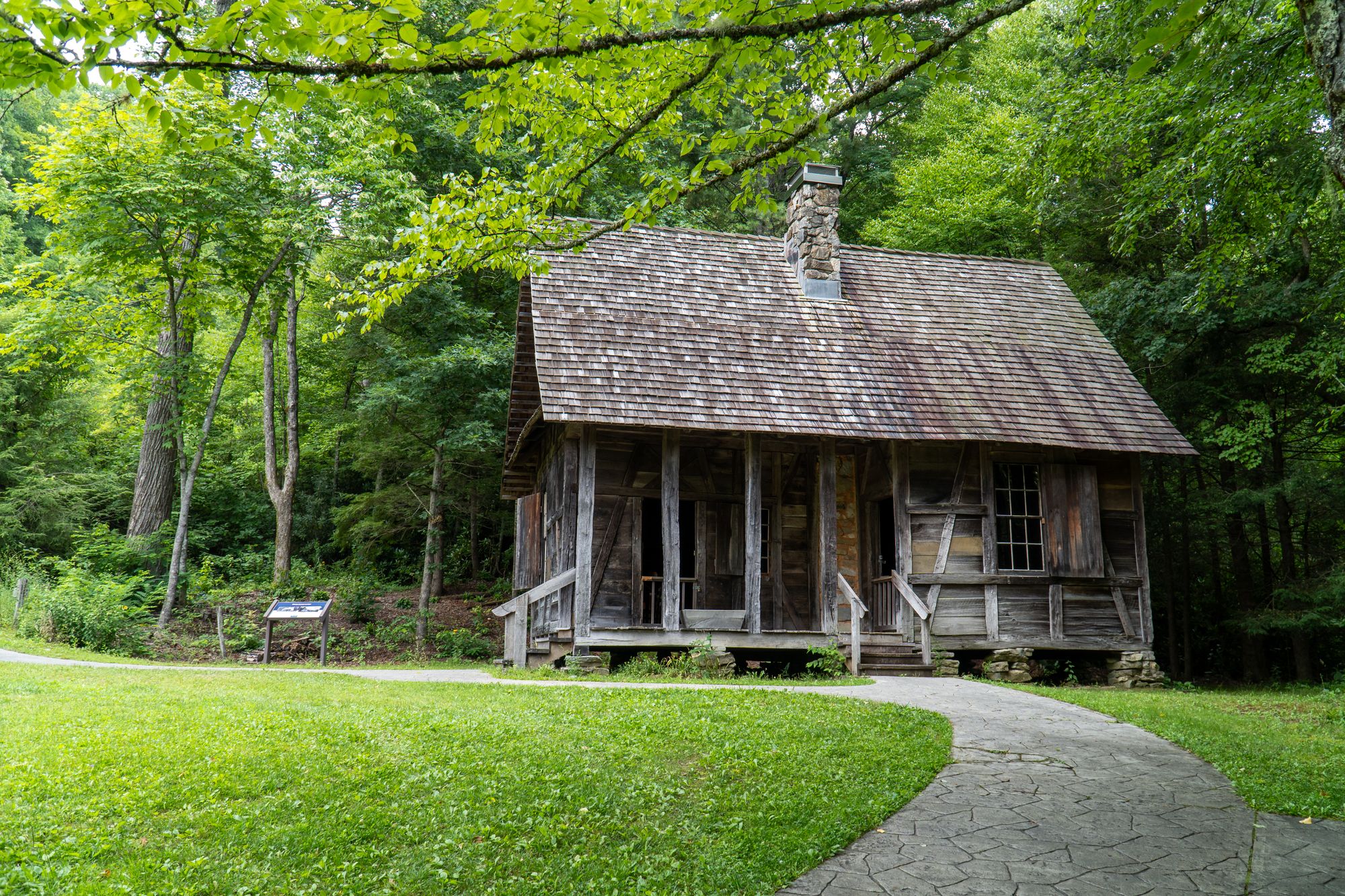 Log cabin in lush green Appalachian woods