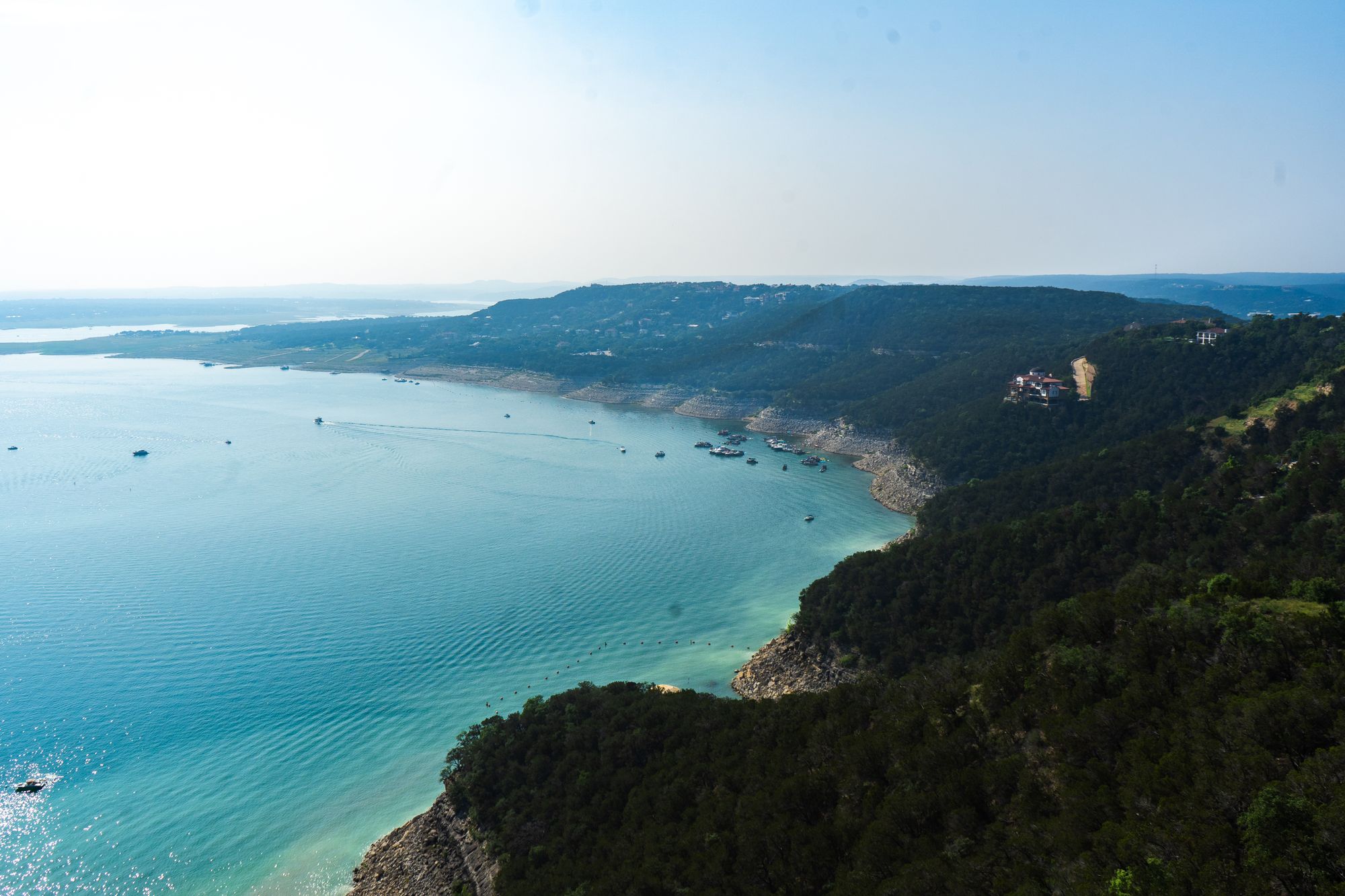 Aerial view of a Texas Hill Country lake surrounded by green hills