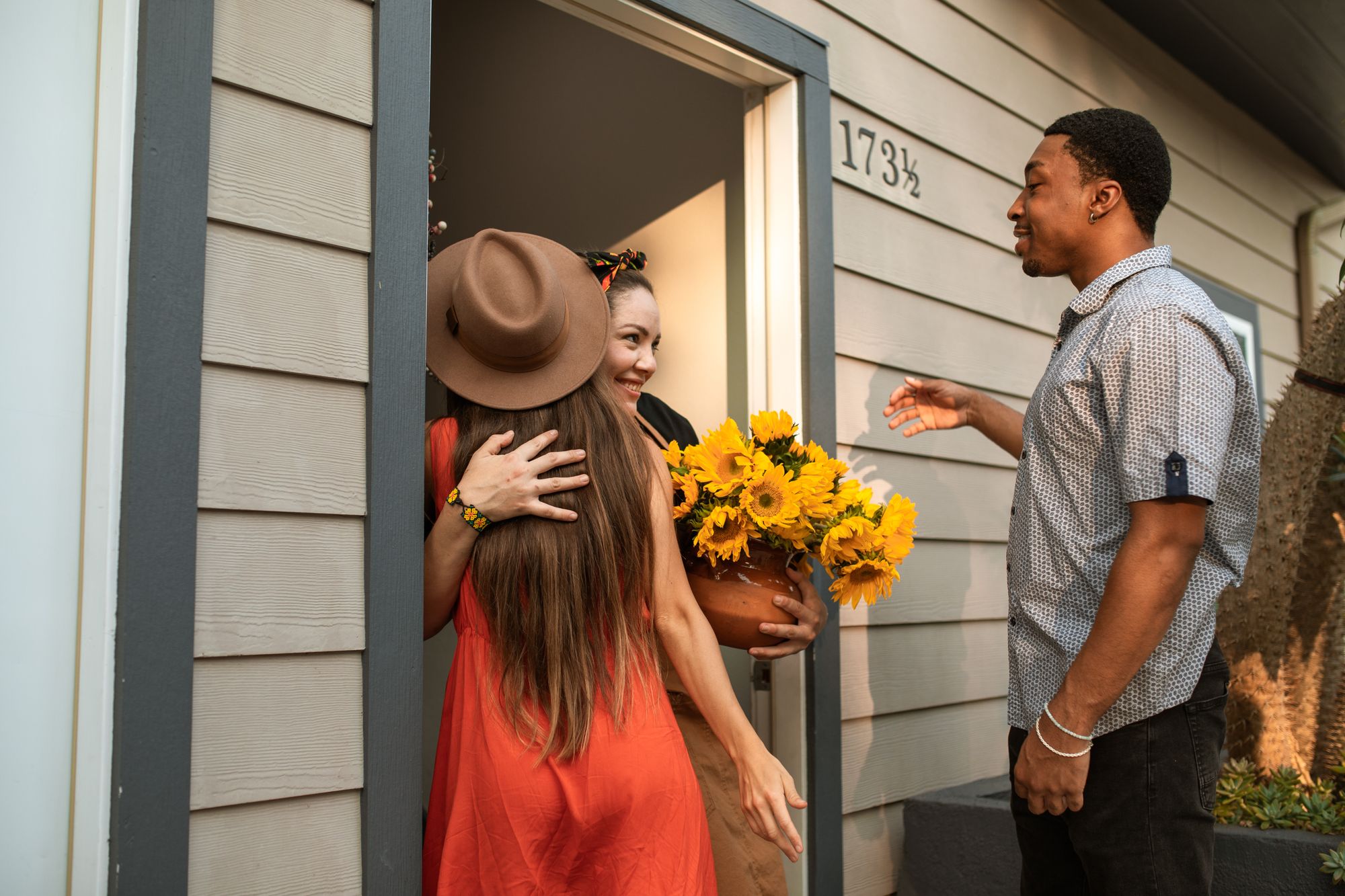A local host welcoming guests at a vacation home