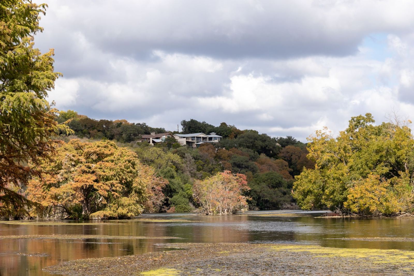 House by a river among trees in New Braunfels, Texas