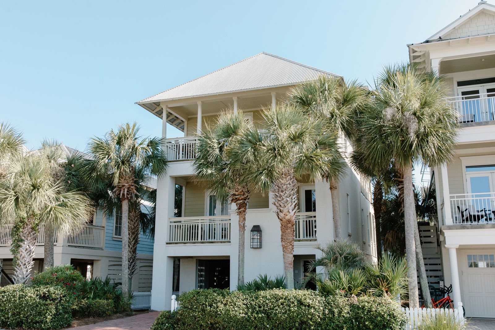 Stock photograph of a sunny coastal home with palms